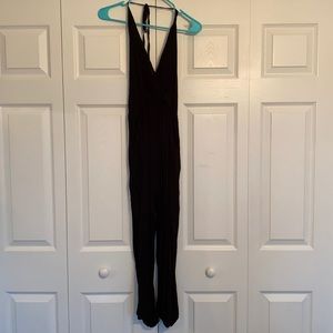 Black halter jumpsuit, open back, pockets, M